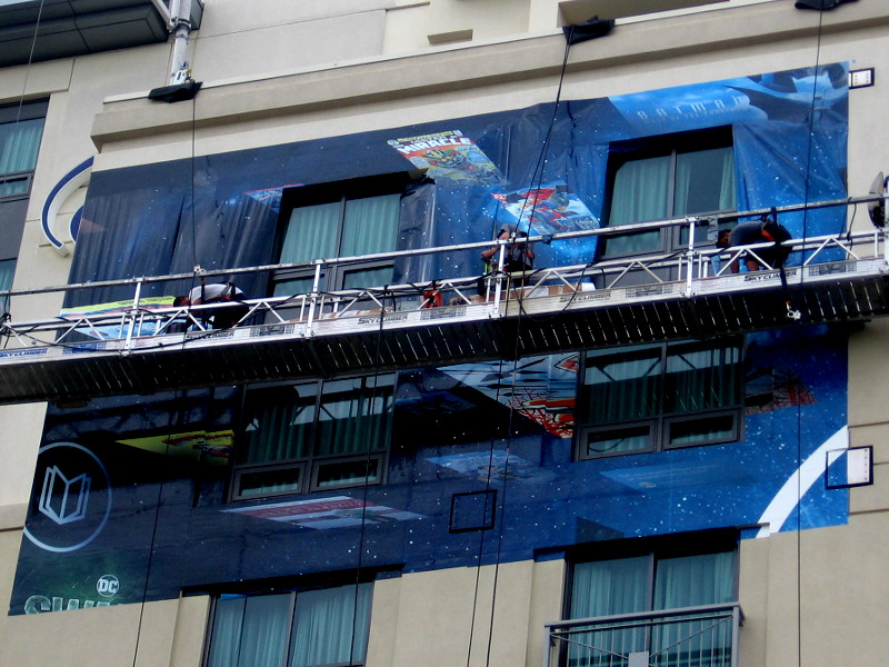 The beginnings of a DC Comics building wrap on the Hilton San Diego Gaslamp Quarter, site of their 2018 Comic-Con offsite!