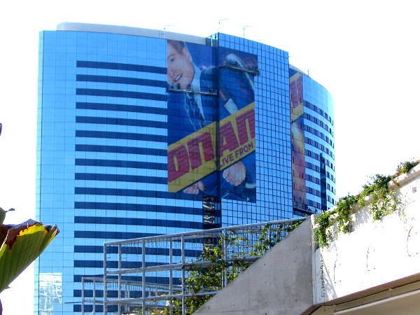 A big Conan O'Brien wrap is being placed on the Marriott Marquis. The design appears similar to this year's Conan trolley wrap.
