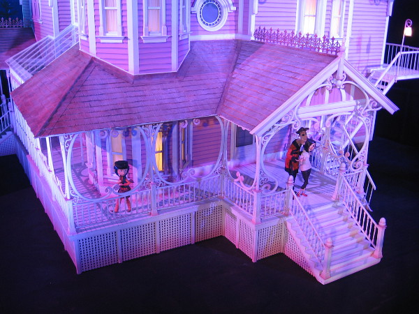A closer look, with models of Coraline characters on the porch.