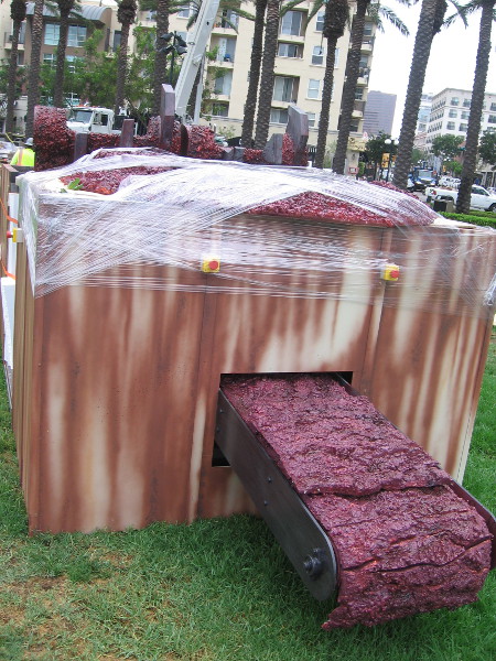 With a bloody conveyor belt!