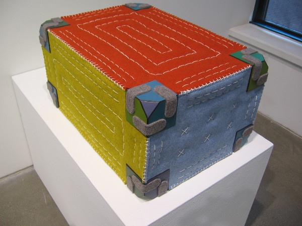 A colorful tumbler that can be sat upon comfortably any which way.