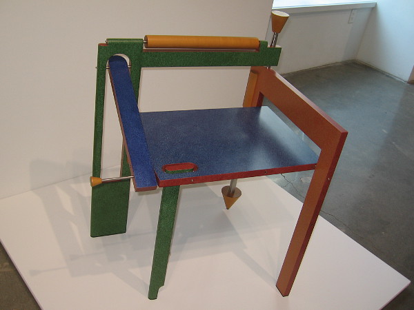 Folding Chair, 1987, painted plywood, maple, stainless steel by artist Tom Loeser.