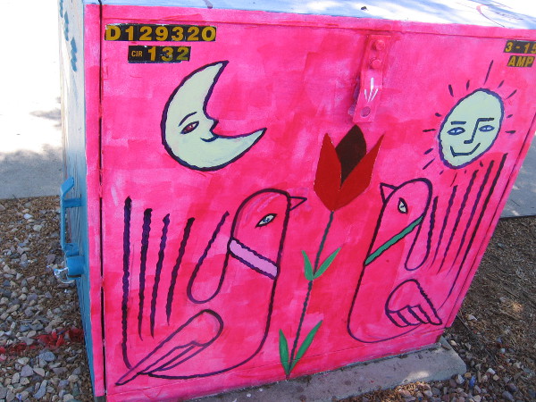 Another side. Two birds, a red flower, the moon and sun.