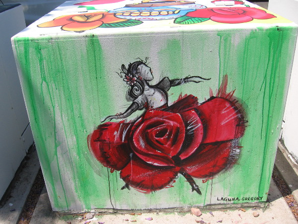 A Mexican ballet folklórico dancer, with a skirt made of a red rose.