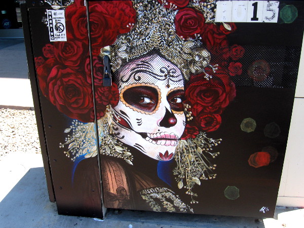 Amazing street art in Barrio Logan. Painting of a face decorated for Día de Muertos, or Day of the Dead.
