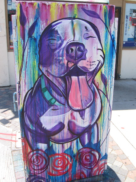 Happy dog street art, with tongue hanging out.