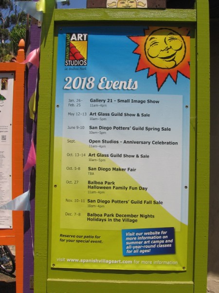 Sign lists 2018 events, including special shows and sales, in Spanish Village Art Studios in Balboa Park.