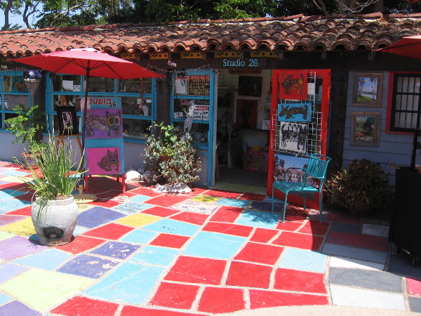 Patio tiles leading visitors to the front door of Studio 26 seem like a Yellow Brick Road of many colors.
