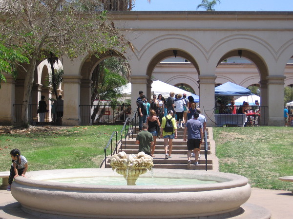 People head up toward the Casa del Prado's outdoor courtyard to enjoy another special event in Balboa Park.
