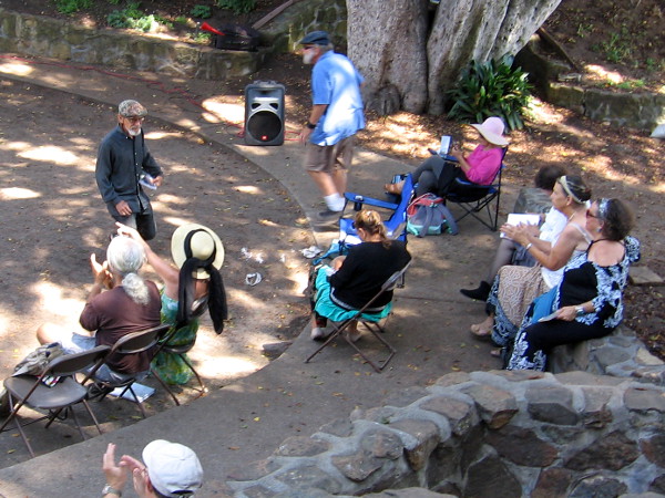 Chris Vannoy, who will be named US National Beat Poet Laureate in September, finishes and earns enthusiastic applause.