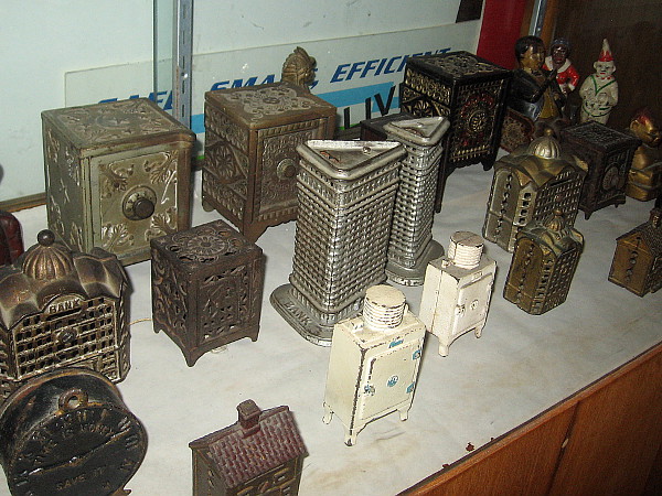 I believe these are cast iron coin banks.