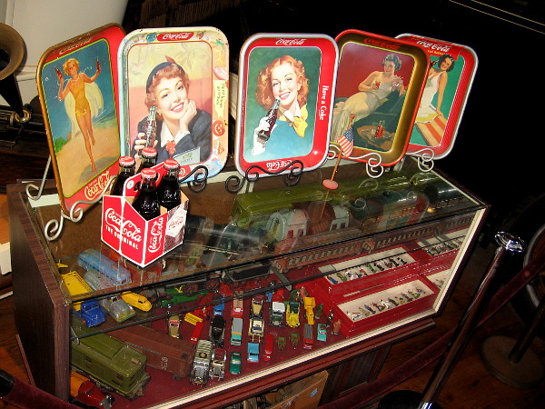 Some classic Coca Cola trays and even more antique collectibles.
