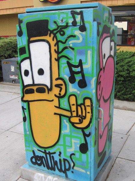 A funky face spray painted on a utility box on El Cajon Boulevard in City Heights.