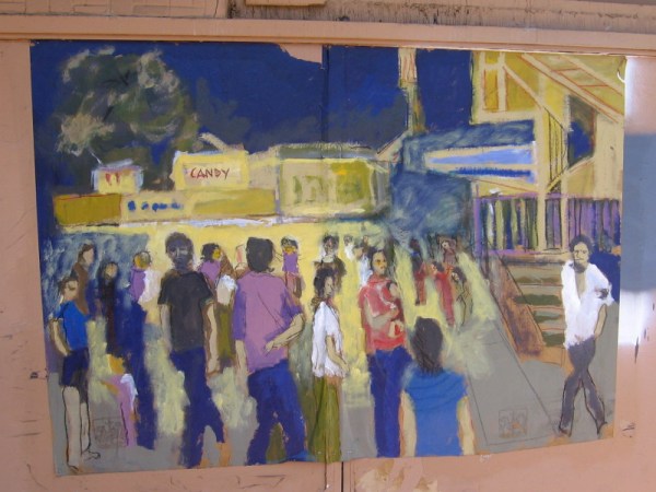 Street art on the front of The Vogue Theater in Chula Vista depicts a night out at the movies.