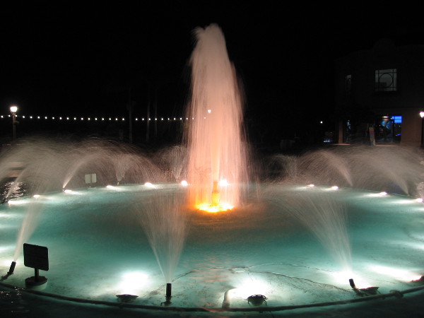 The Bea Evenson Fountain lit at night.