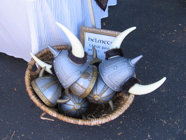 A basket full of plastic two-horned Viking helmets.