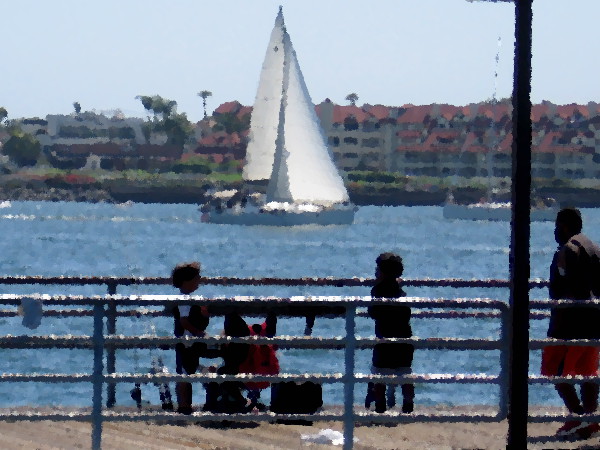 Fishing from a pier on sunlit San Diego Bay.