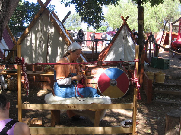 A lady at work making Viking crafts.
