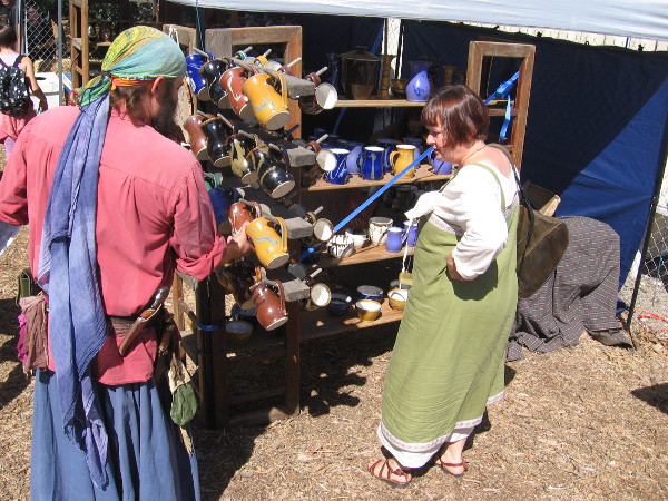 Another sold lots of colorful mugs.