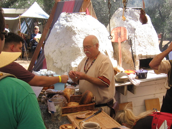 Bread was being baked in two large outdoor earthen ovens.