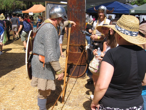 A Viking combat demonstration had just ended, and some festival visitors were talking to one of the participants.