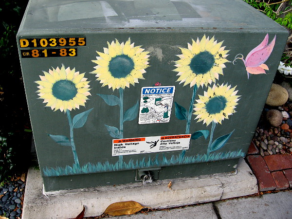 Painted sunflowers grow upon a transformer box in Coronado.