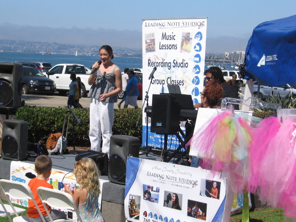 Young lady sings during a cool event on San Diego's Embarcadero--the first ever Kidpreneur Expo!