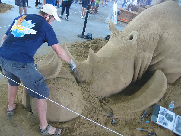 Brian Turnbough finishes a tribute to the endangered rhinoceros.
