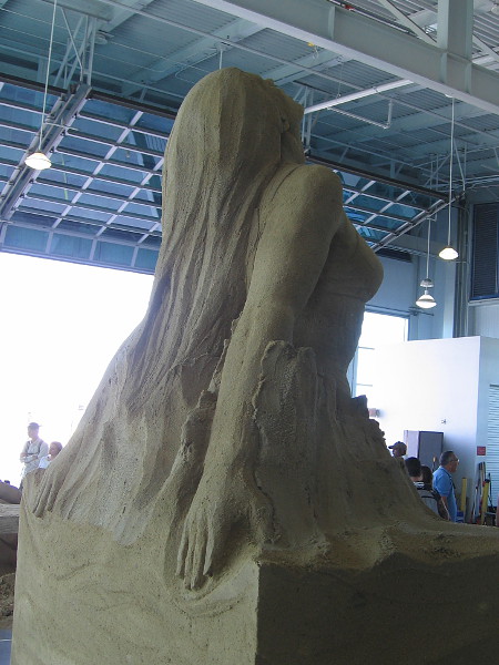 Flowing beauty magically rises from a block of sand.