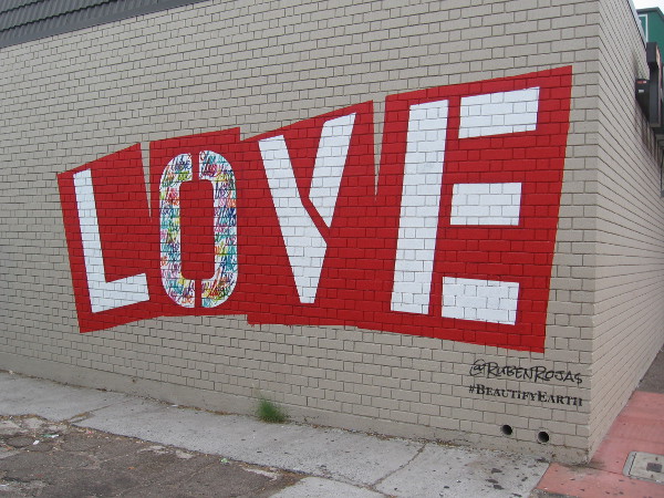 Los Angeles muralist Ruben Rojas, co-founder of Beautify Earth, painted LOVE on the side of 7-Eleven in City Heights.