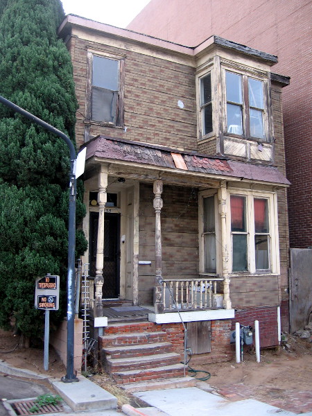 This might be the most dirty, decrepit, ramshackle house in downtown San Diego. One day it will probably vanish in a cloud of dust.
