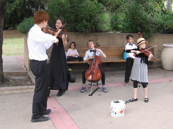 De la Motte Strings musicians perform in Balboa Park.