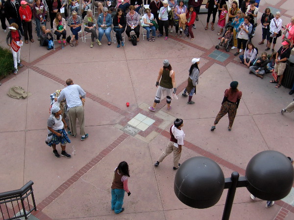 The dancers spread out and face the audience.