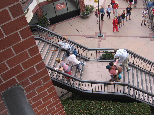 The dancers exit the stage by struggling up two sets of stairs at Hazard Center.