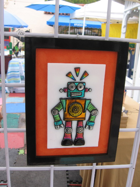 This cool glass robot and the next two photos show small bits of hand etched dichroic glasswear made by ChrisStell CreativeArts.