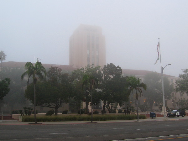 San Diego's distinctive County Administration Building appears ghostly in a morning fog.