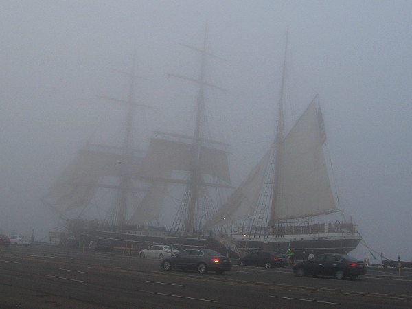 The historic tall ship Star of India appears through the fog on San Diego's Embarcadero.