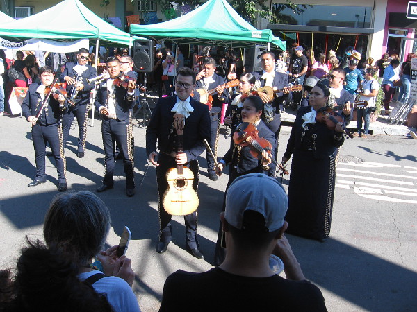 Mariachis performed joyful music for the crowd at one end of the city block.