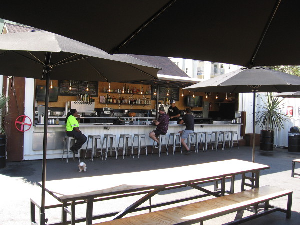 In addition to Burgers and Bites by a small event stage, Quartyard features benches and this outdoor bar.