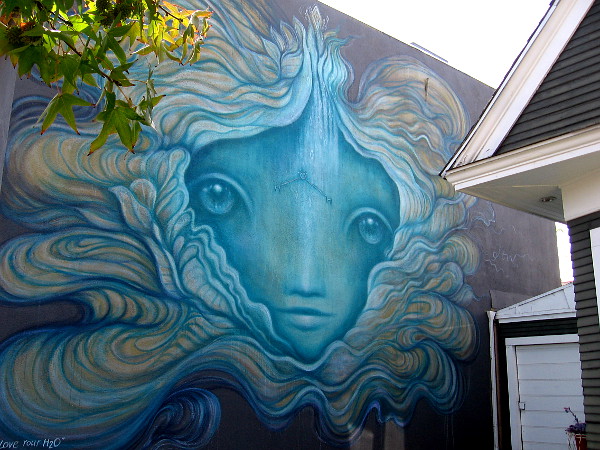 Love Your H2O, a mural painted by local artist Gloria Muriel for the Sea Walls: Murals for Oceans project.