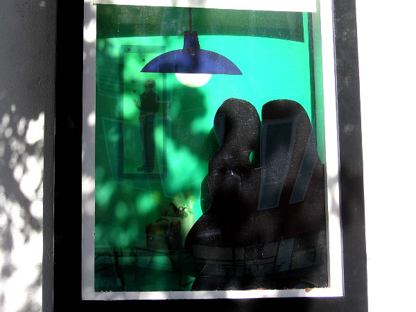 A child in the arms of a loving adult in another window.