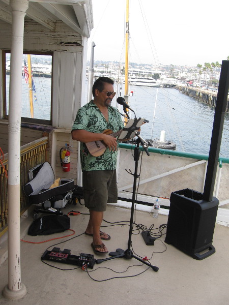 This cool dude up on the passenger deck of the Berkeley was playing mellow island music.