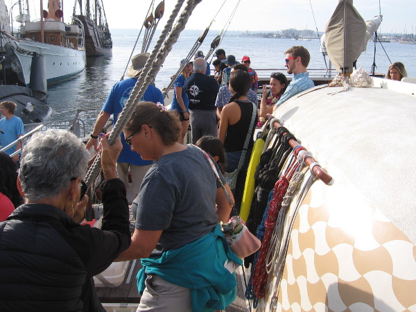 Lots of curious visitors were walking about the wooden deck of the Polynesian canoe.