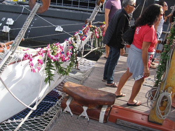 Garlands of tropical flowers decorate the bow of Hikianalia.