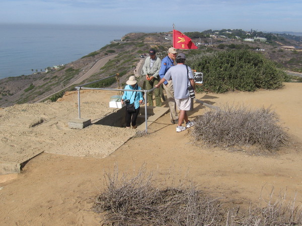 Visitors to Cabrillo National Monument enter the restored Base End Station and Battery Commander's bunker north of the Old Point Loma Lighthouse. Battery Ashburn can be seen in the distance.