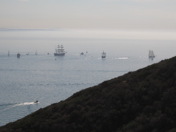 The ships sail past the end of Point Loma. My old camera can barely photograph them at this distance.