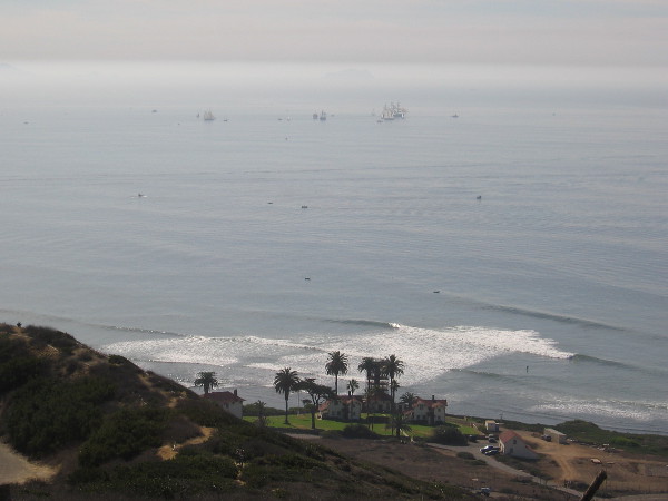 Ships melt into the hazy distance.