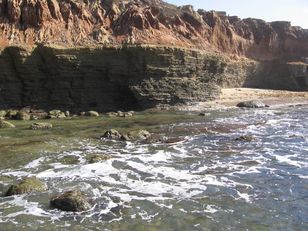 The slowly uplifted then eroded sandstone cliffs also tell a story in their book-page-layers about the passage of time.