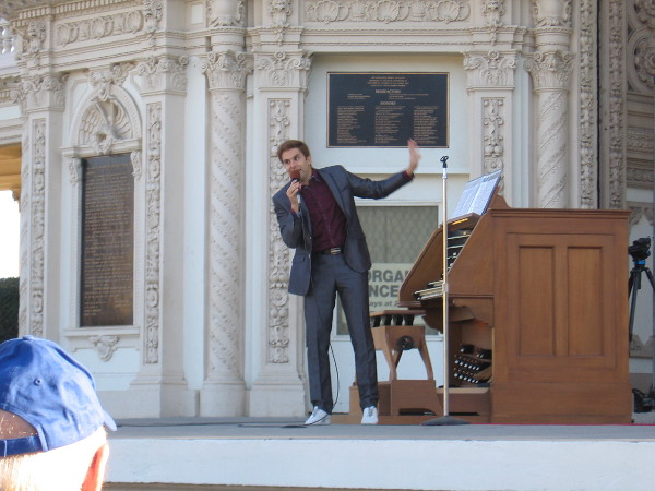 Raúl Prieto Ramírez, San Diego's Civic Organist, talks to the audience during the free Sunday concert at two o'clock.