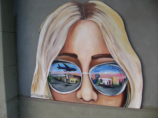 Cool sunglasses reflect images from Little Italy.